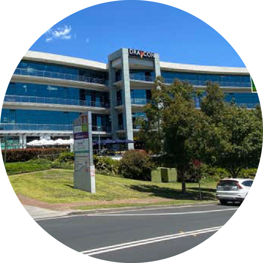 Modern office building housing Chatterbox Speech therapy services in Australia, featuring glass facades and commercial signage.