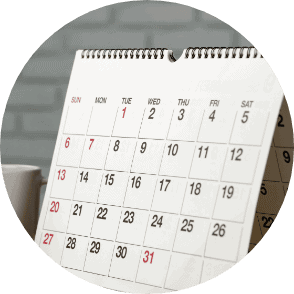 A desk calendar showing dates, symbolising organisation and planning for speech therapy sessions at Chatterbox Speech.