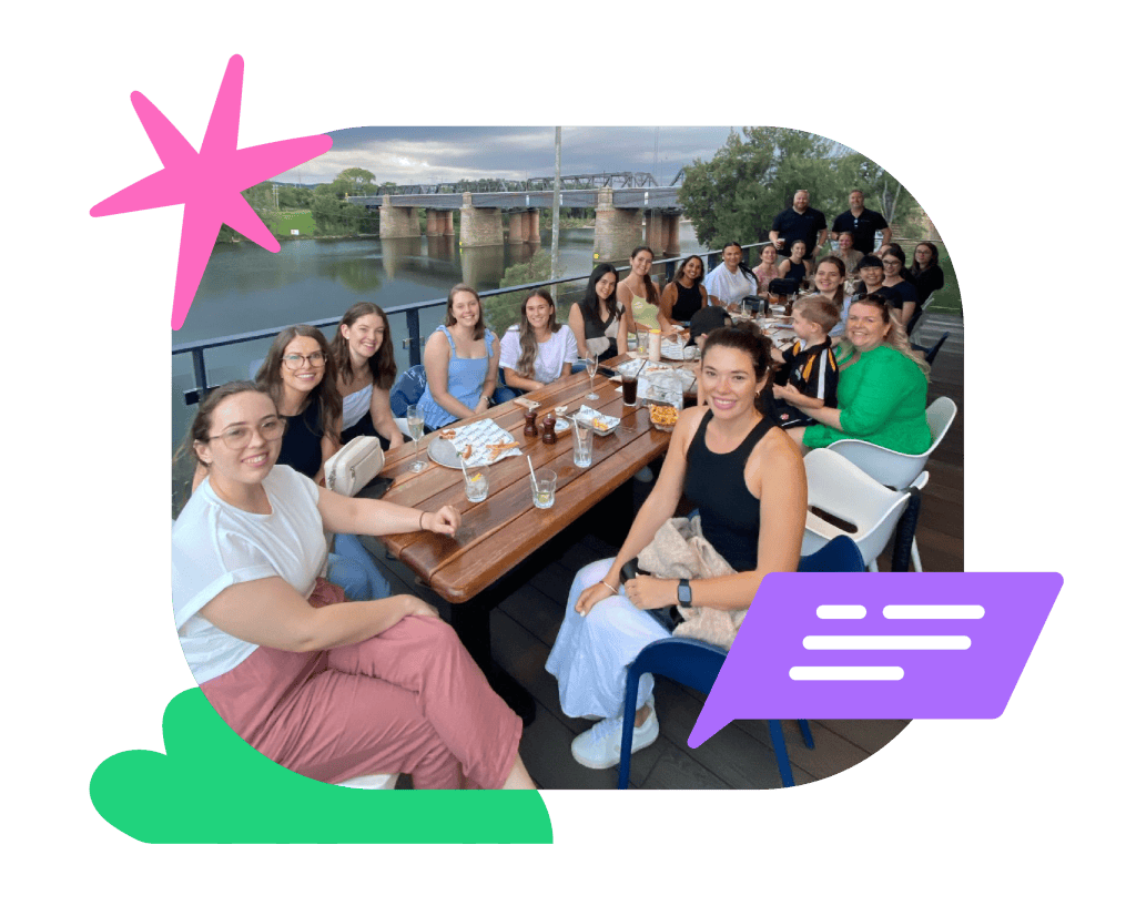 Vibrant group enjoying a speech therapy social event outdoors by the river, engaging in communication activities at Chatterbox Speech in Australia.