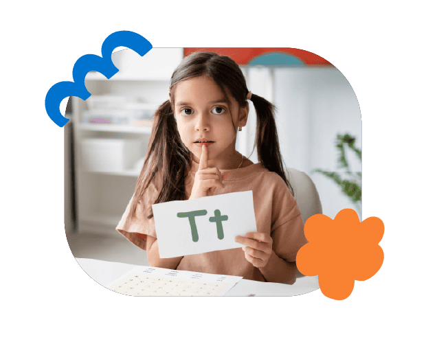 Young girl holding letter "Tt" card demonstrating speech therapy for children at Chatterbox Speech clinic in Australia.