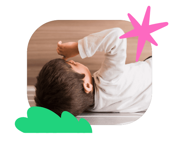 Child lying on floor, engaging in speech therapy exercises at Chatterbox Speech clinic in Australia.