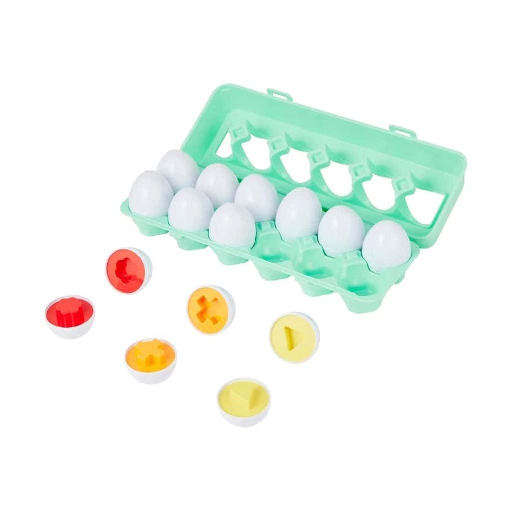 Plastic eggs with removable red and yellow caps, used for speech therapy activities to improve communication skills in children.