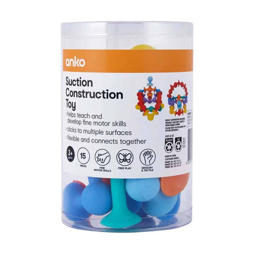 Suction construction toy with colorful pieces, designed to help children develop fine motor skills and sensory tactile skills, suitable for ages 3 and up.